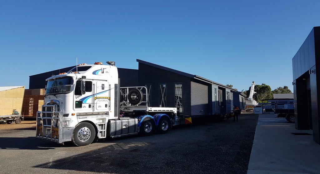 A completed module leaving the Anchor Homes factory in Stratford for Wollongong, NSW.