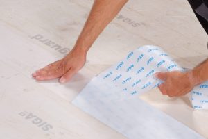 Wetguard 200 SA moisture protection installation on floorboards