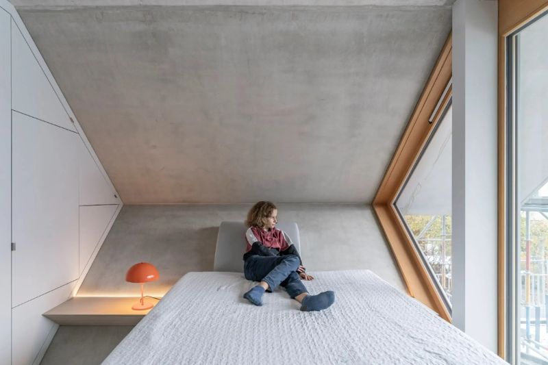 The precast concrete modular apartment features customisable living spaces.